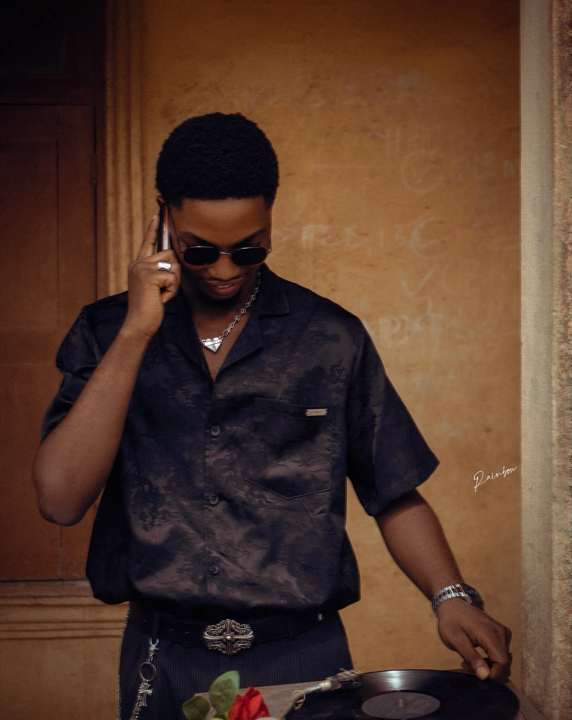 Close portrait of a man in sunglasses on a call